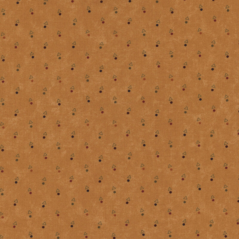 A mottled amber orange fabric with triangles and multicolored dots. 