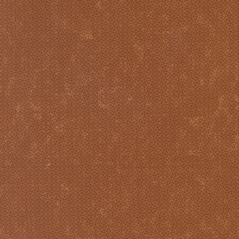 A mottled amber orange fabric with an arrangement of abstract tonal lines. 