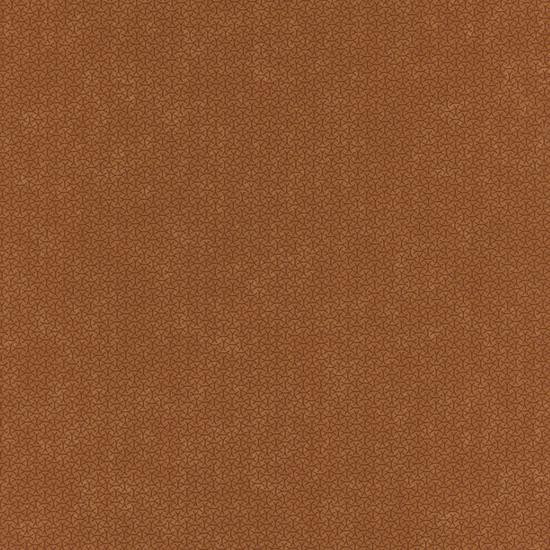 A mottled amber orange fabric with an arrangement of abstract tonal lines. 