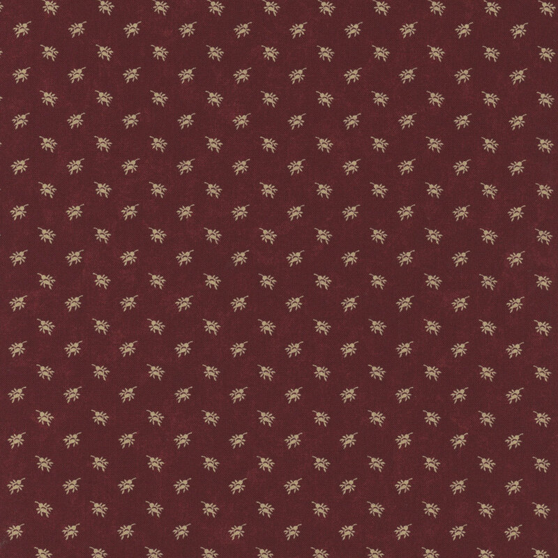 A mottled brick red fabric with cream rosebud sprays. 