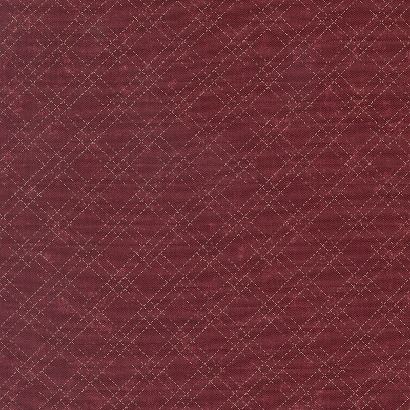 A mottled brick red fabric with an cream stitched plaid design. 