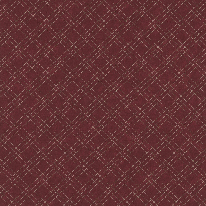 A mottled brick red fabric with an cream stitched plaid design. 