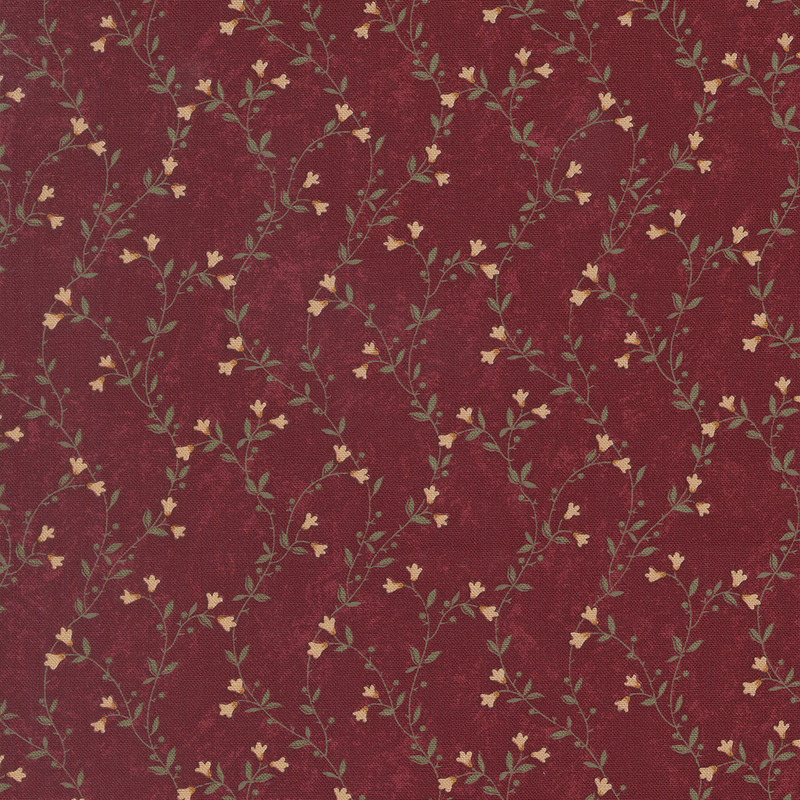 A mottled brick red fabric featuring delicate green vines with cream flowers. 