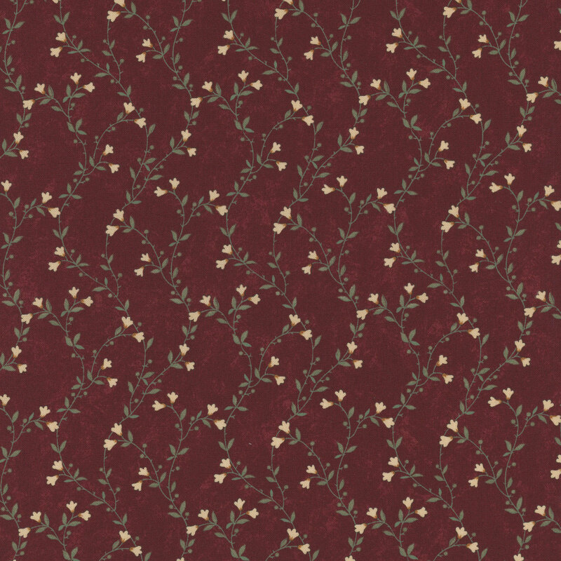 A mottled brick red fabric featuring delicate green vines with cream flowers. 