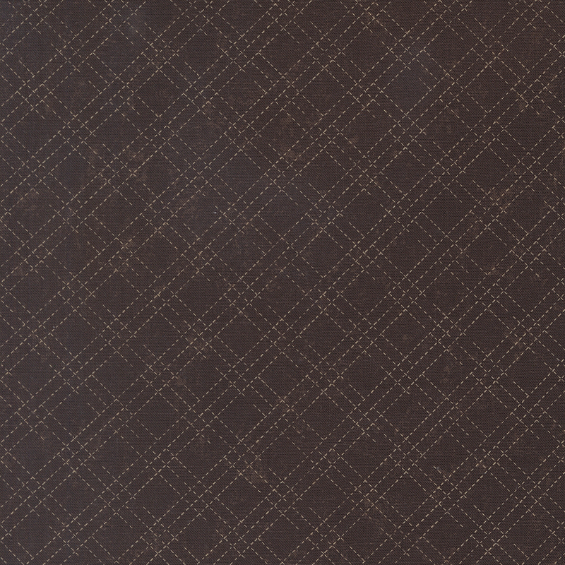 A mottled earthy brown fabric with an cream stitched plaid design. 