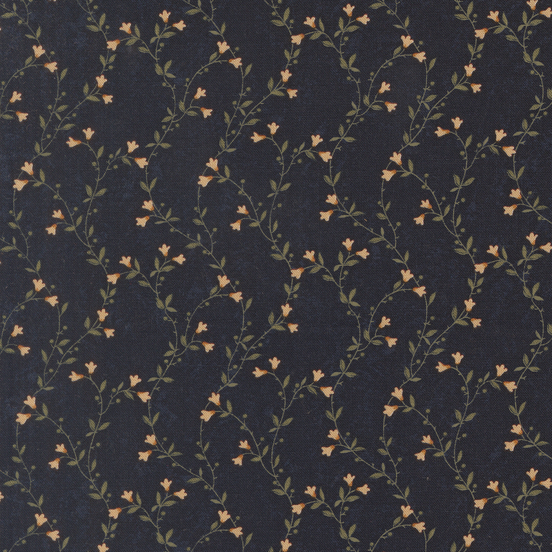 A mottled indigo blue fabric featuring delicate green vines with cream flowers. 