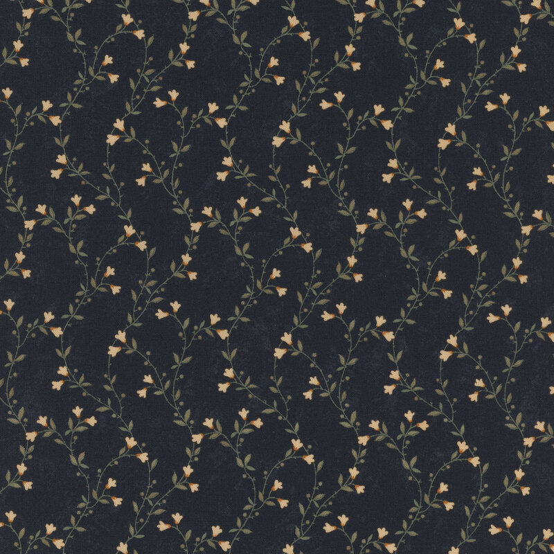 A mottled indigo blue fabric featuring delicate green vines with cream flowers. 