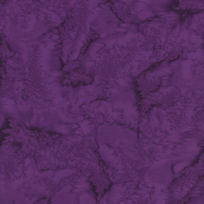 Fabric swatch of the 405 Wild Berry Watercolor Batik, a mottled and tonal dark magenta print.