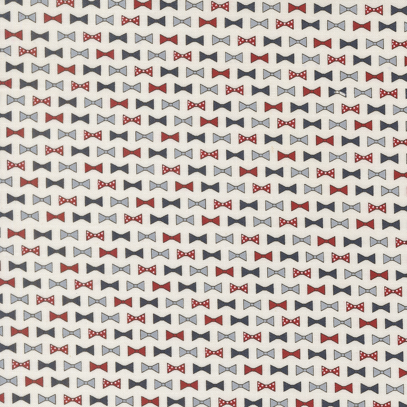 rows of bowties in red, cornflower blue, navy blue, and red with white polka dots on cloud white fabric