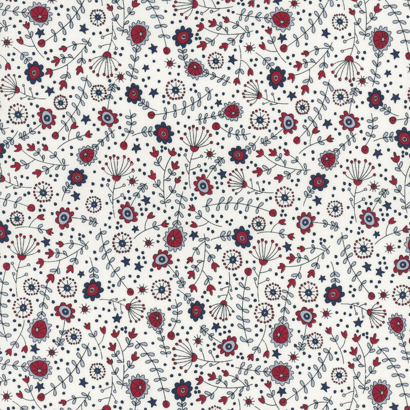cloud white fabric featuring tossed stars, flowers, leaves, and stems in red, cornflower blue, and navy blue