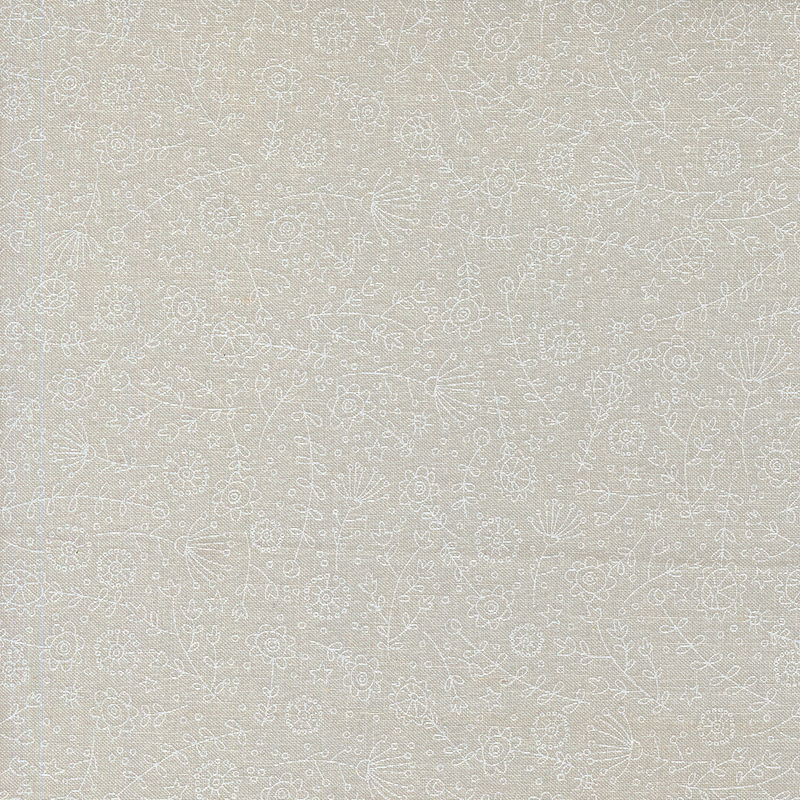 white on white fabric featuring the outlines of tossed stars, dots, and florals.