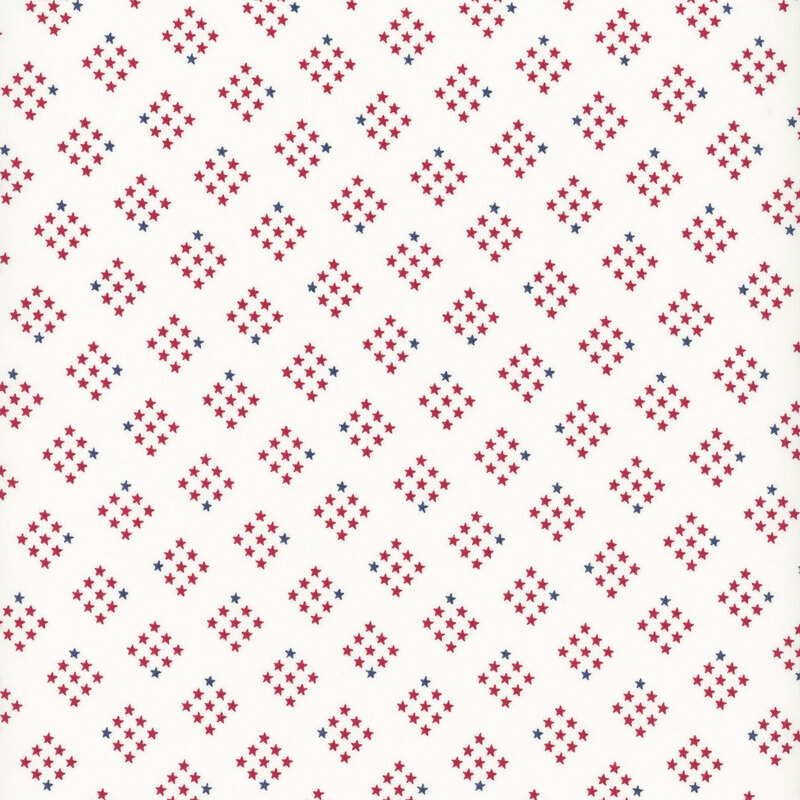 cloud white fabric featuring diamond-shaped clusters of red and navy stars