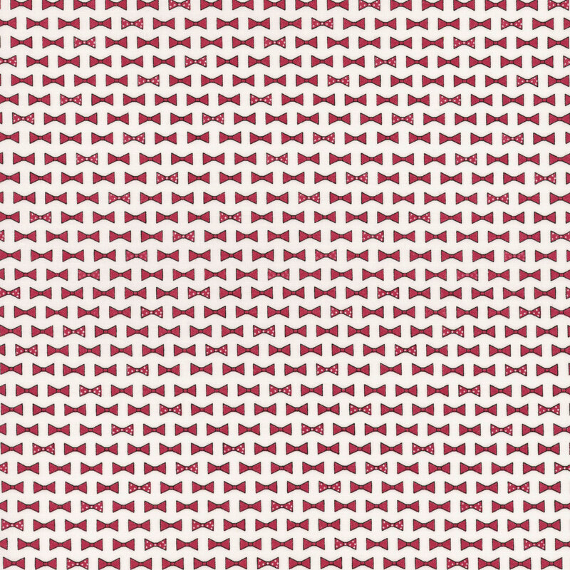 diagonal rows of bowties in red and red with white polka dots on cloud white fabric