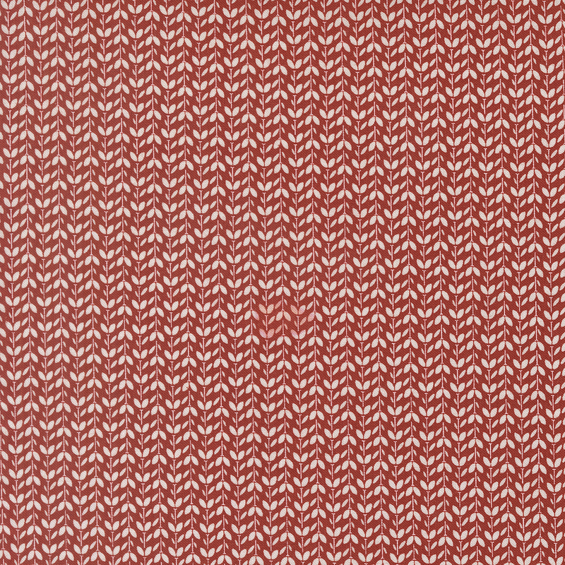 cardinal red fabric packed with white vines and leaves in alternating directions