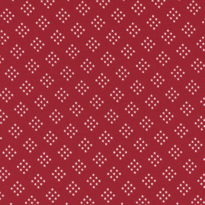 bright red fabric featuring diamond-shaped clusters of white stars