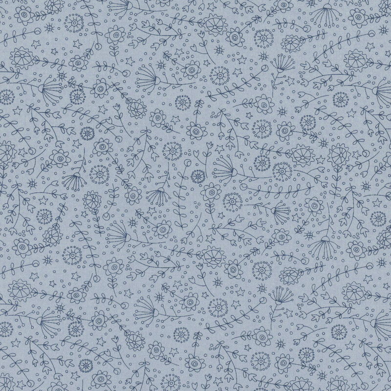 tonal blue fabric featuring the outlines of tossed stars, flowers, leaves, and stems