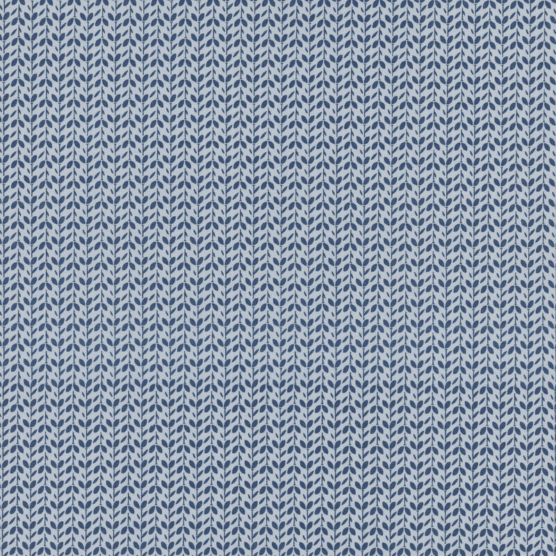 tonal blue fabric packed with vines and leaves in alternating directions