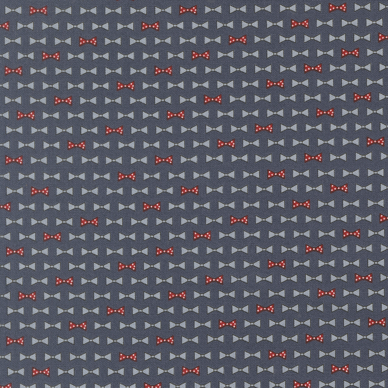 diagonal rows of bowties in cornflower blue and red with white polka dots on navy blue fabric