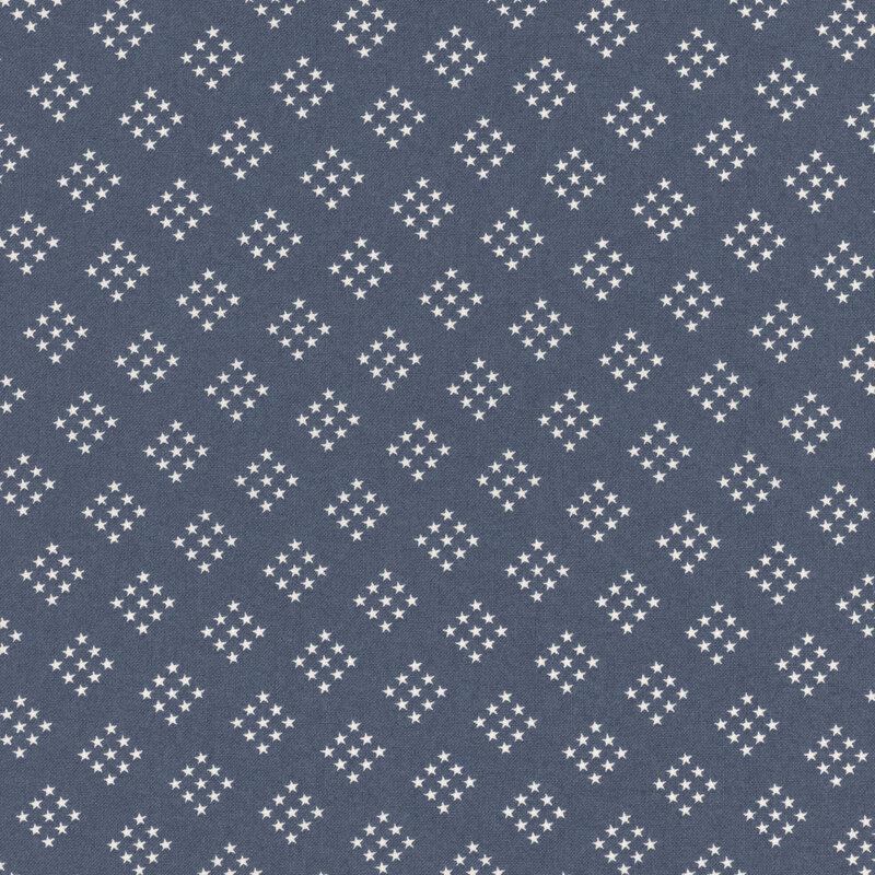 navy blue fabric featuring diamond-shaped clusters of white stars