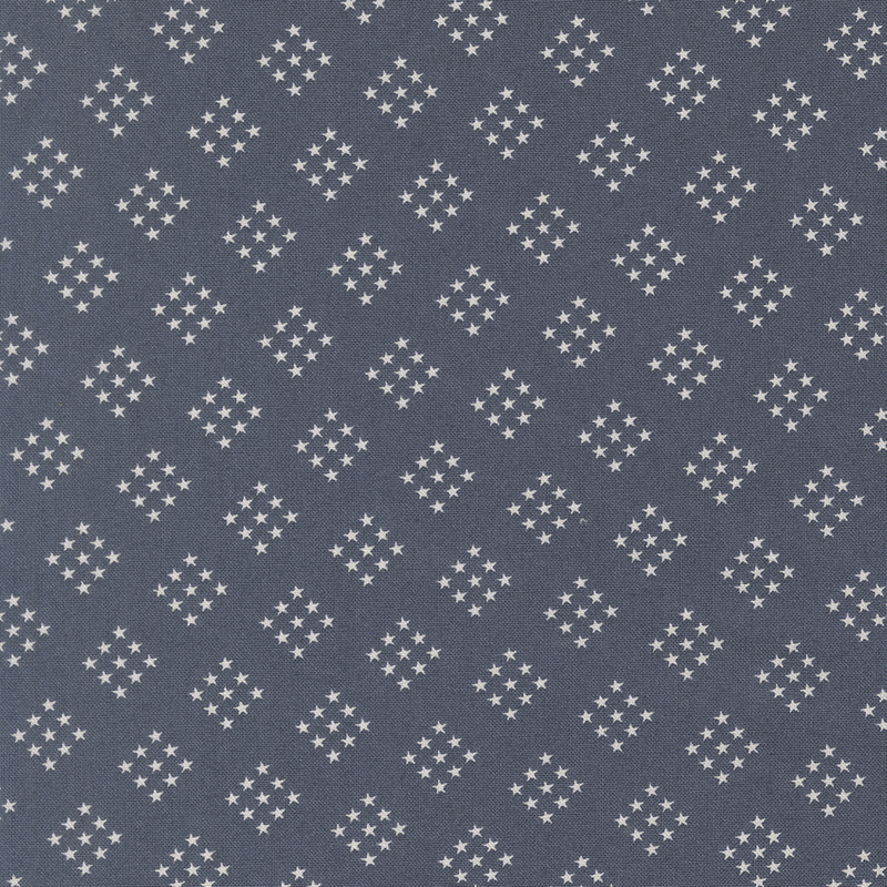navy blue fabric featuring diamond-shaped clusters of white stars