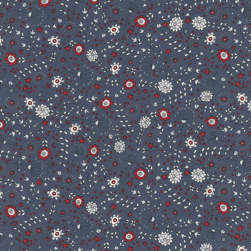 navy blue fabric featuring tossed stars, flowers, leaves, and stems in red, cornflower blue, and light gray