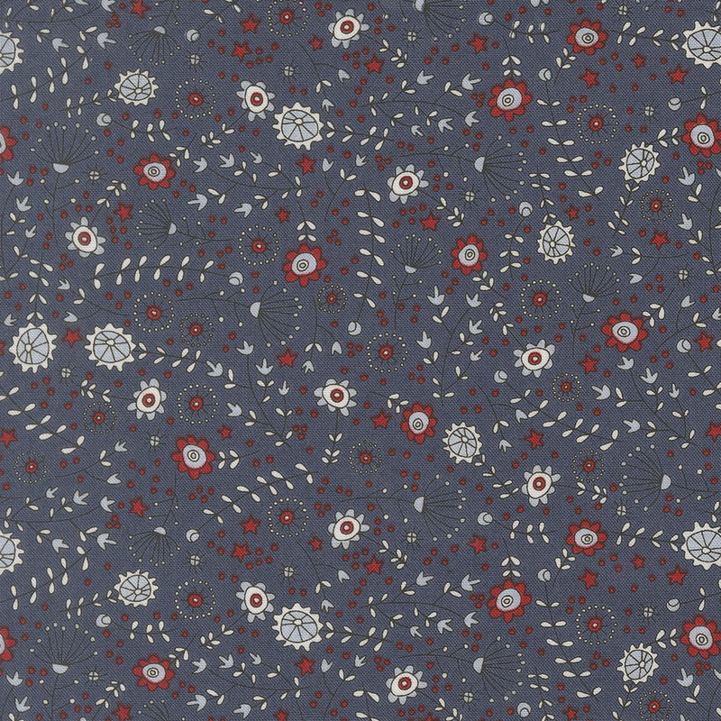 navy blue fabric featuring tossed stars, flowers, leaves, and stems in red, cornflower blue, and light gray
