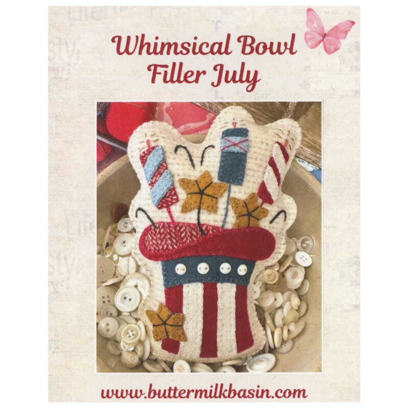 Front cover of the pattern showing the completed project on resting on bowl of buttons..