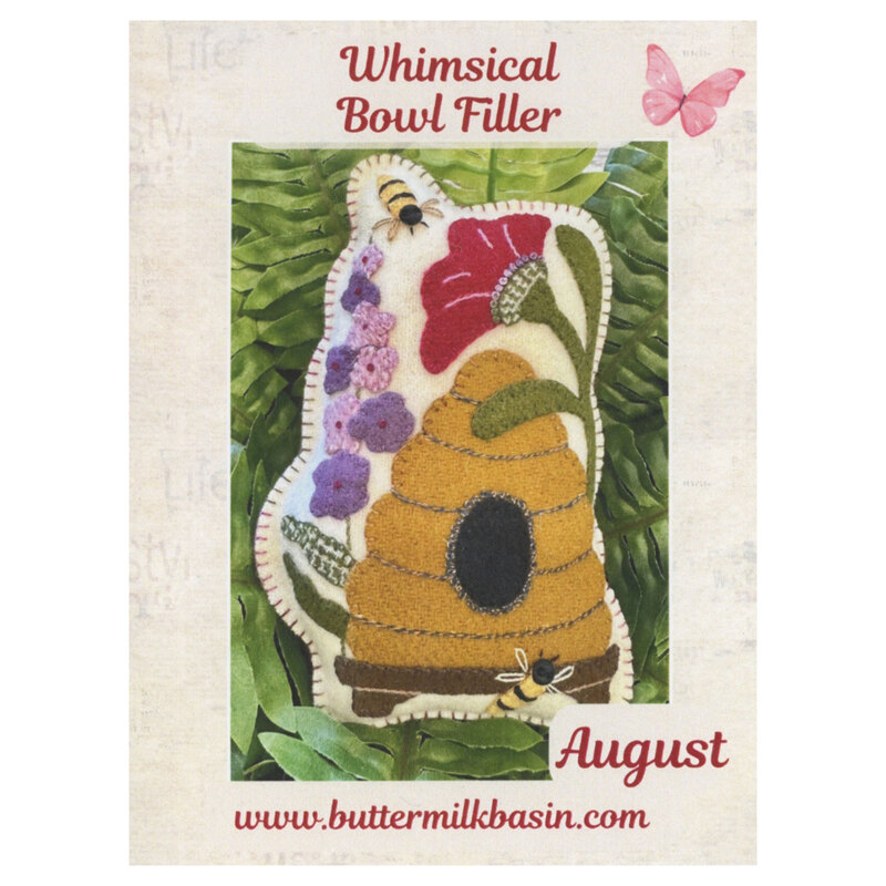 Front cover of the pattern showing the completed project on resting on fern leaves.