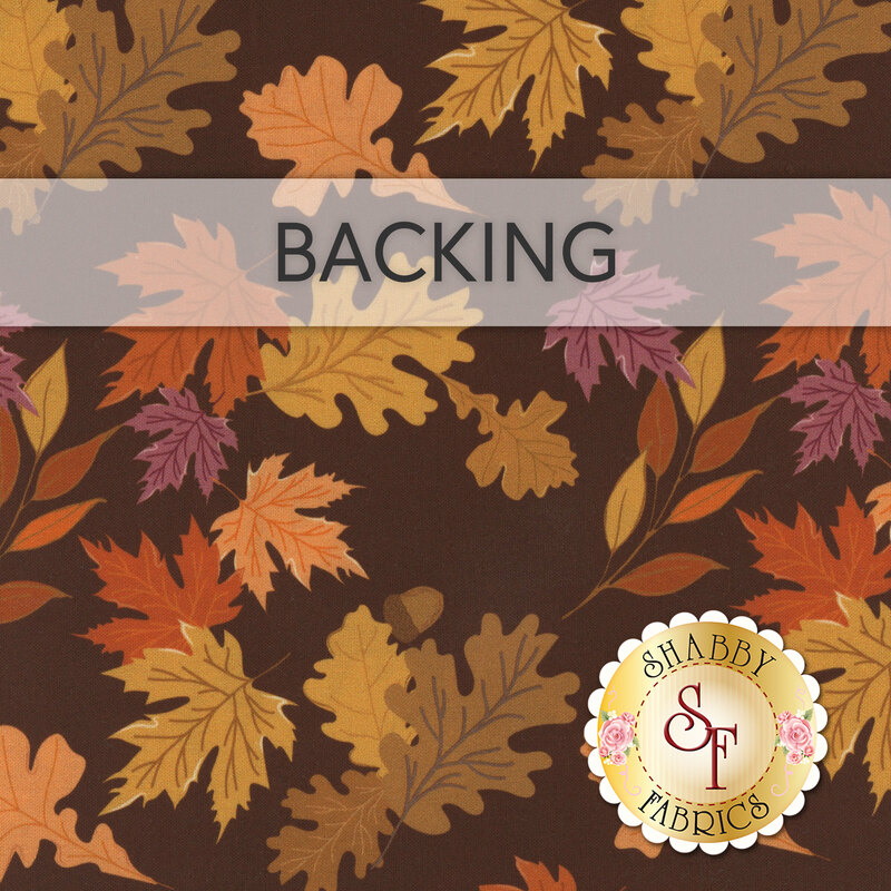 A swatch of brown fabric with acorns and gold, brown, and purple leaves blowing past. A banner at the top reads 