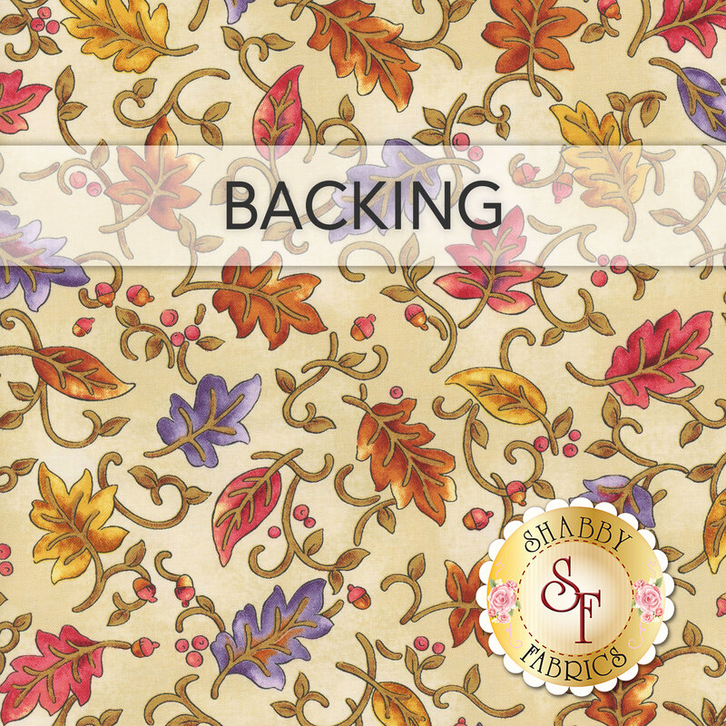 A swatch of cream fabric with gold, red, and purple falling leaves. A banner at the top reads 