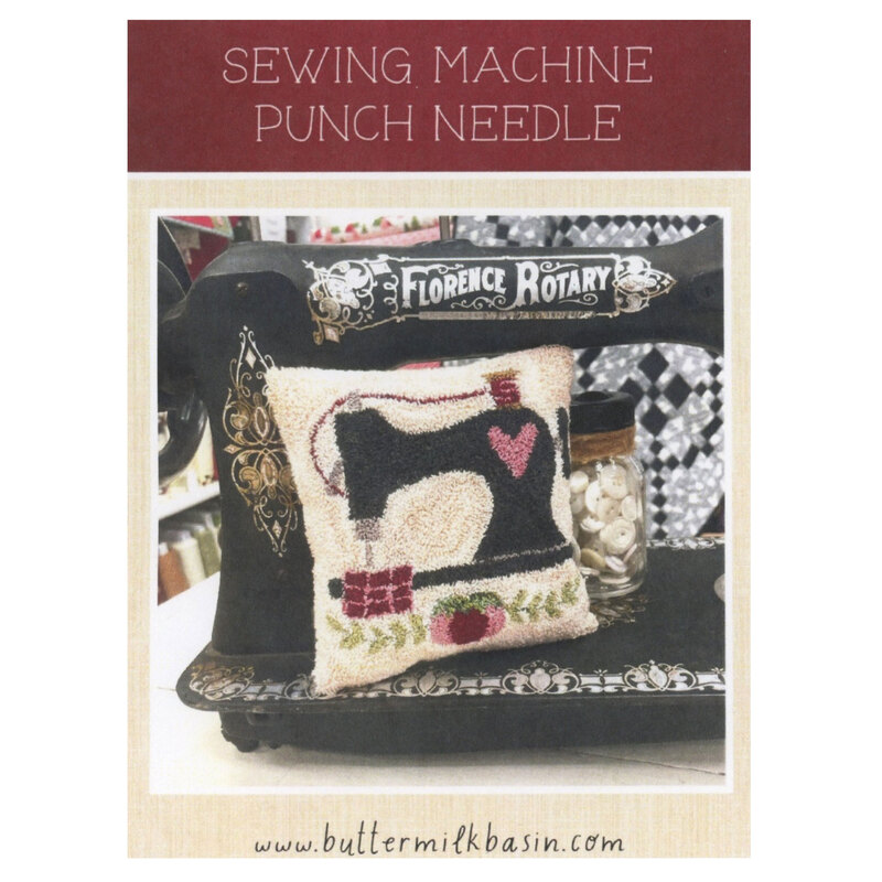 Front of the pattern showing the completed project, a sewing machine a heart and pin cushion..