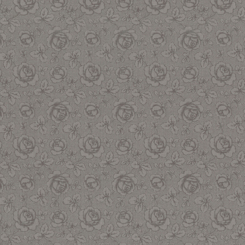 Tonal dark gray fabric featuring tossed roses and leaves on a textured background