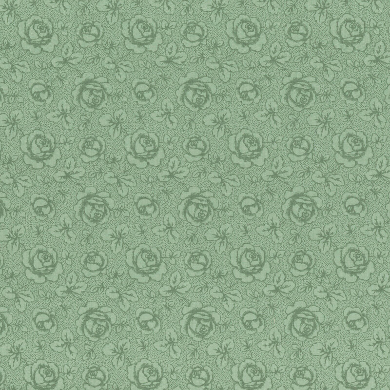 Tonal mint green fabric featuring tossed roses and leaves on a textured background