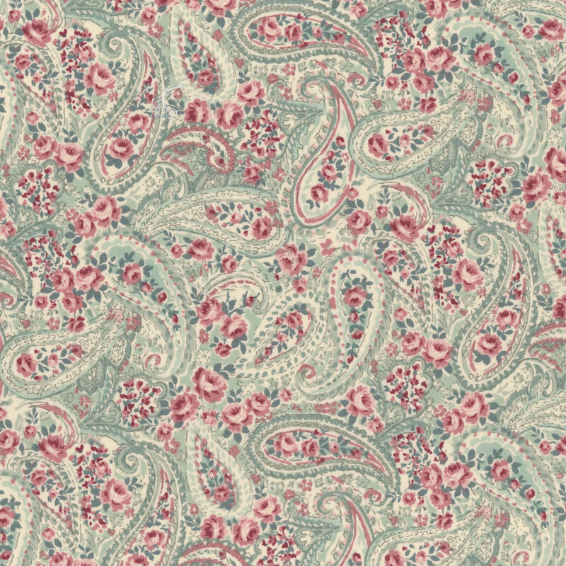 paisley pattern in hues of green surrounded by pink roses on mint green fabric
