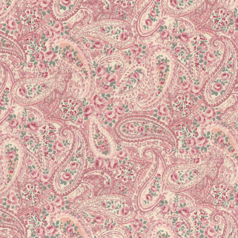 paisley pattern in hues of pink and surrounded by roses on rose-pink fabric