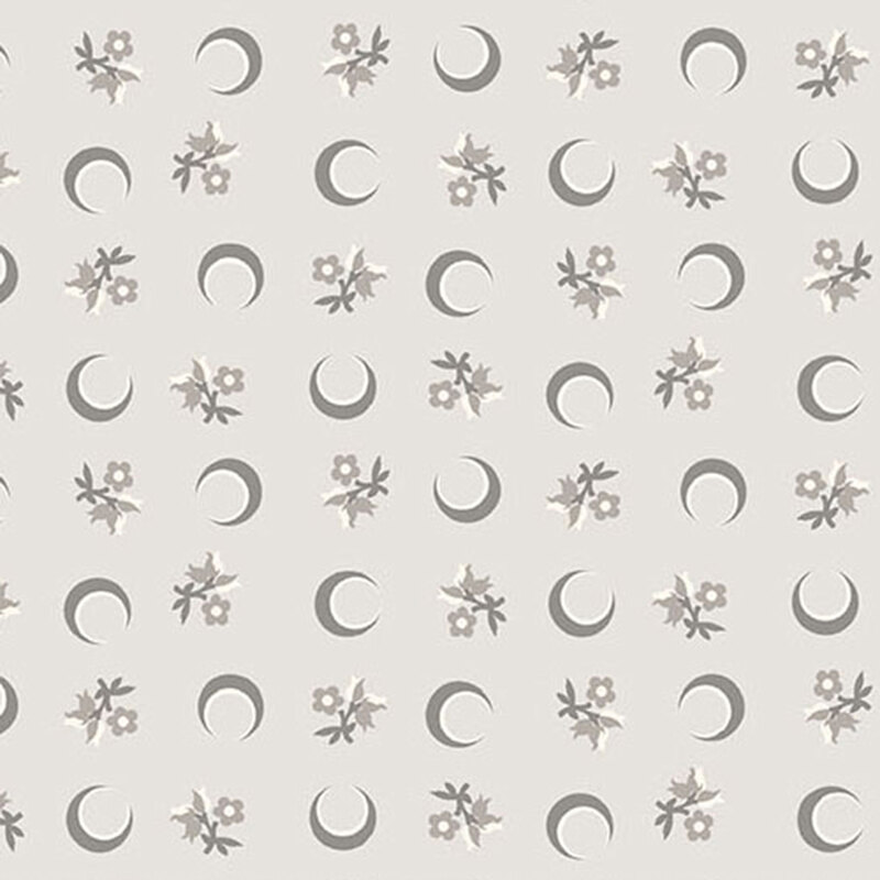 Gray fabric with a ditsy pattern of crescent moons and florals.