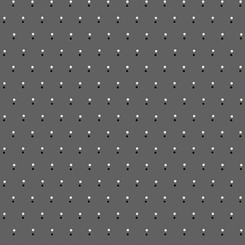 Gray fabric with a pattern of evenly spaced dots in black and white.