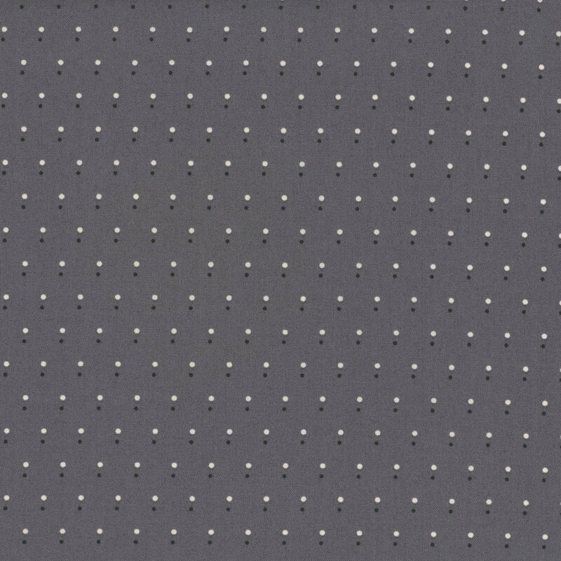 Gray fabric with a pattern of evenly spaced dots in black and white.