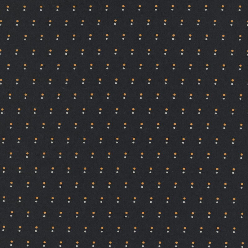 Black fabric with a pattern of evenly spaced dots in orange and white.