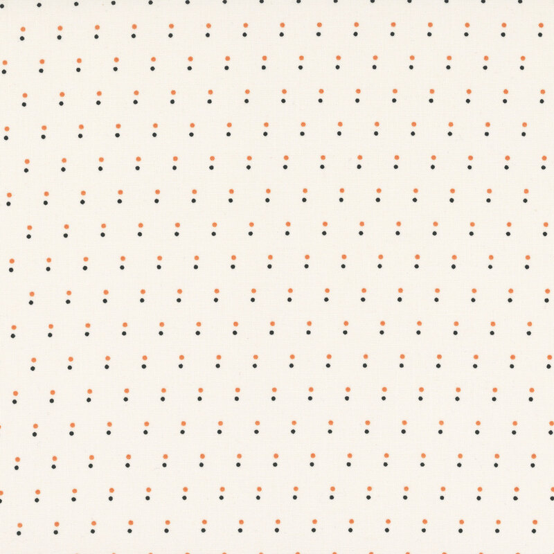 Cream fabric with a pattern of evenly spaced dots in black and orange.