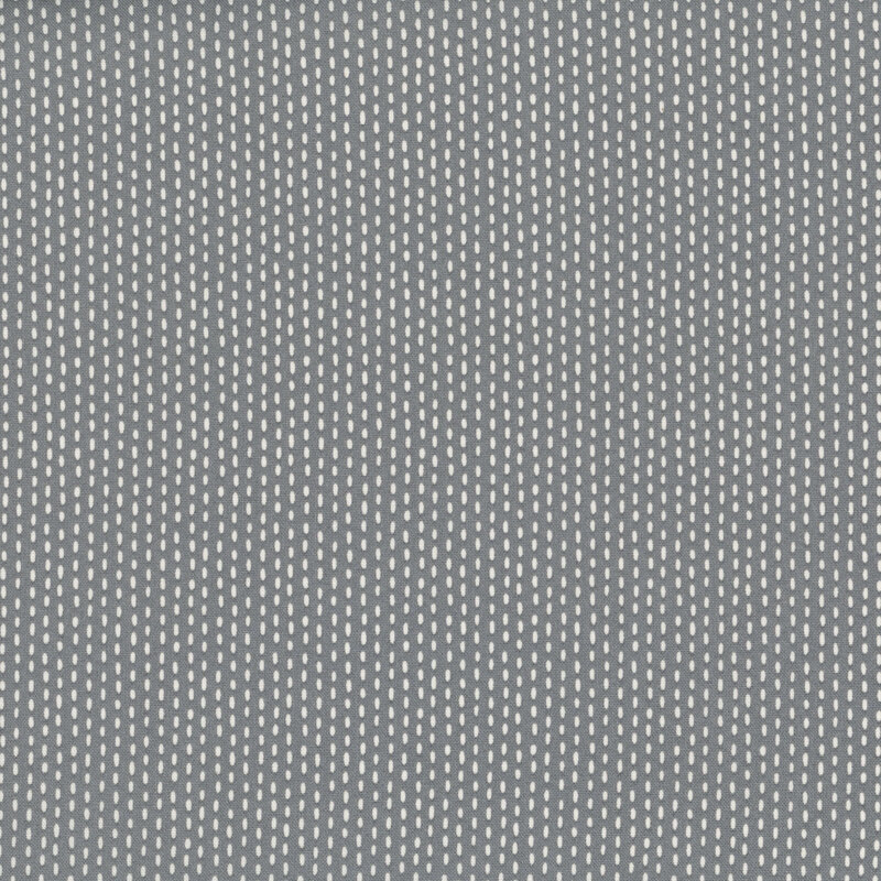 Gray fabric with white stripes formed by a stitch pattern.