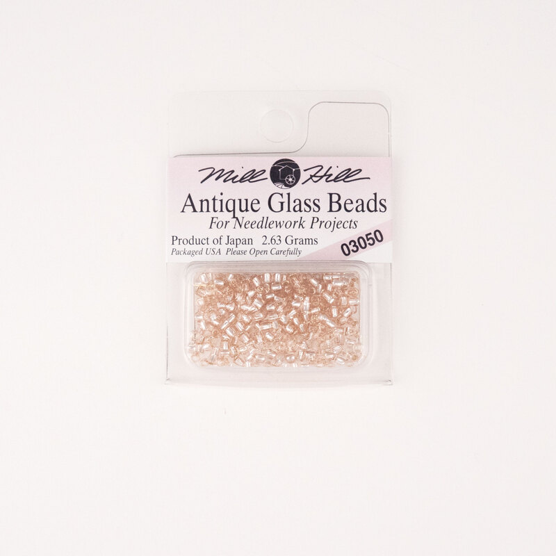 A package of Mill Hill Antique Seed Beads in the color champagne ice. 