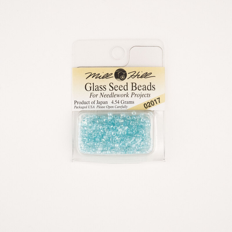 A package of Mill Hill Glass Seed Beads in the color crystal aqua