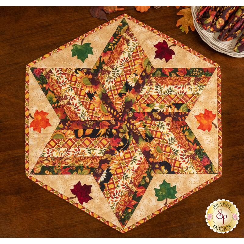 A top down shot of the table topper, demonstrating color and patchwork details.
