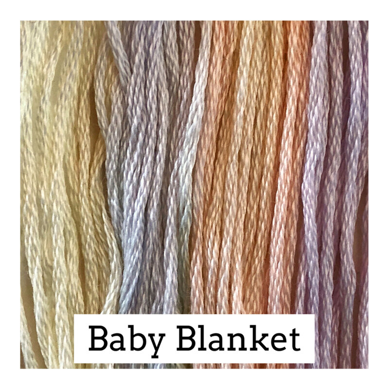 A variegated swatch of Classic Colorworks floss in the colors peach, light purple, light blue and yellow. 