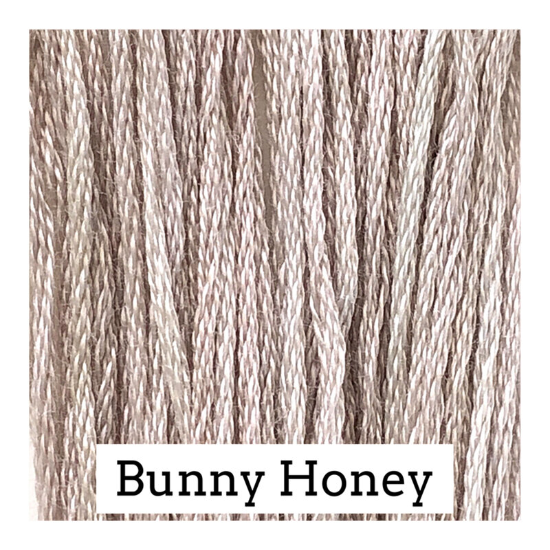 A cream swatch of Classic Colorworks floss. 