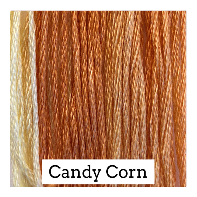 A variegated swatch of Classic Colorworks floss in the colors orange and yellow