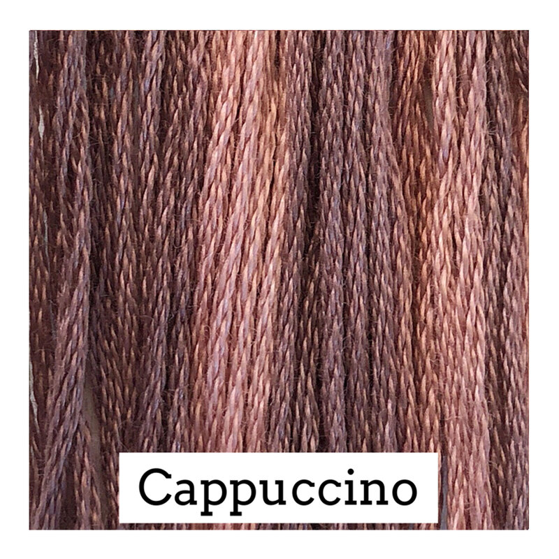 A variegated swatch of Classic Colorworks floss in the colors A variegated swatch of Classic Colorworks floss in the colors muted pink and warm gray. 