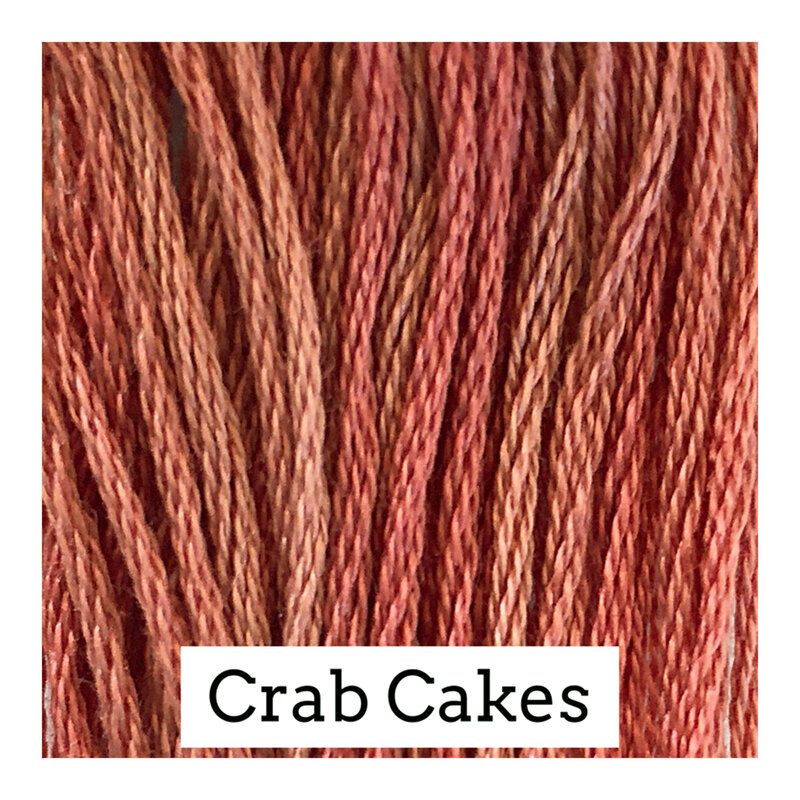 A muted red swatch of Classic Colorworks floss. 