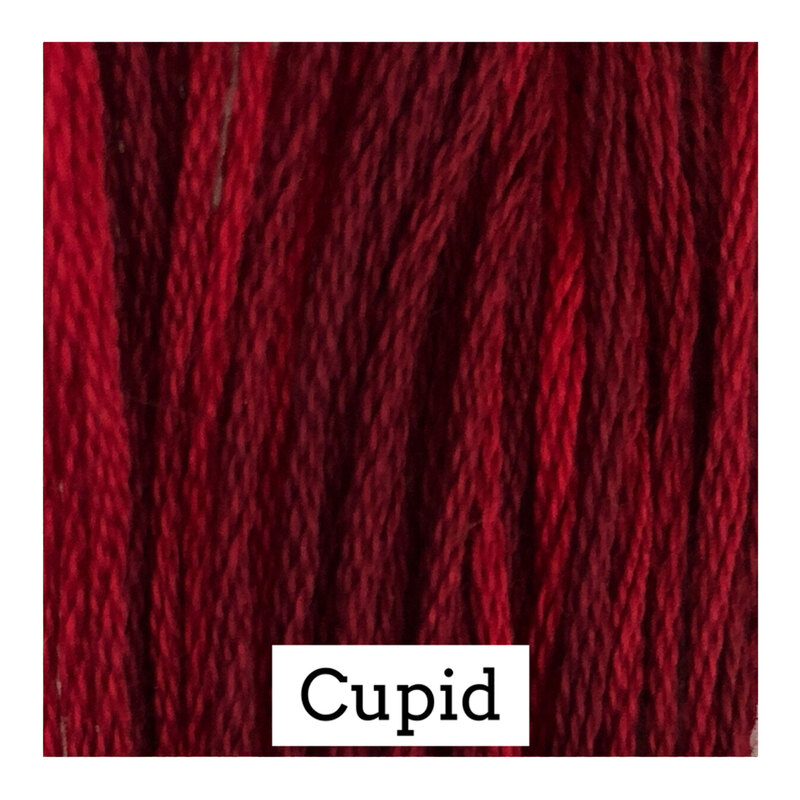 A variegated swatch of Classic Colorworks floss in the colors red and dark red. 
